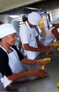 Date: 05/18/2011 Location: Paraguay Description: Workers prepare dough at El Progreso Honey and Bakery in Belen. © USAID Image