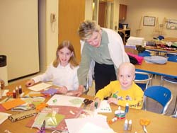 Cokie Roberts visiting two children at The Children’s Inn