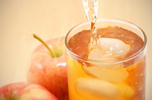 Apple juice being poured into a glass