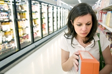 Shopper reading a food label