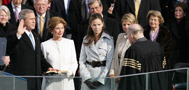 President George W. Bush takes the oath of office to serve a second term as 43rd President of the United States, January 20, 2005, during a ceremony at the U.S. Capitol. Laura Bush, Barbara Bush, and Jenna Bush listen as Chief Justice William H. Rehnquist administers the oath. (P44290-391)
