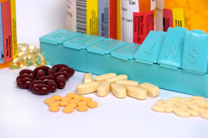 medicine, medicine bottles, and a pill organizer