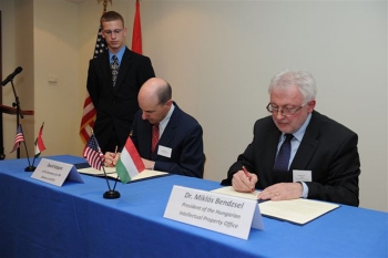 Kappos and Miklós Bendzsel signing a memorandum of understanding