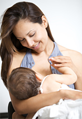 A mother breastfeeds her child.