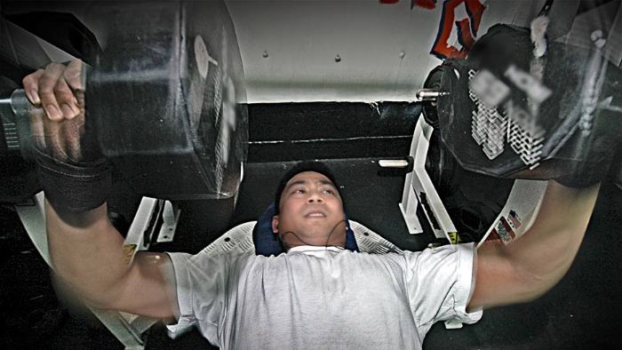 Personnel Specialist performs a butterfly dumbbell press