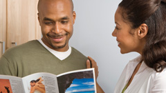 Resources - image of an Africa-American man and woman looking at a brochure of information