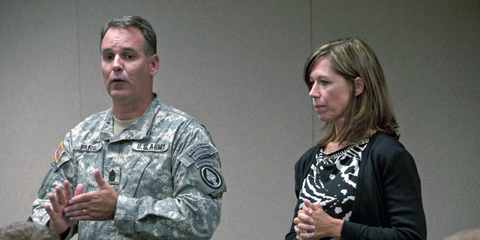 Command Sgt. Maj. and Lisa Faris talk to families at JBLM