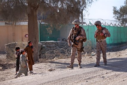 U.S. Marine Corps 1st Lt. David W. Roberts, left, participates in a security patrol in the Garmsir district in Afghanistan's Helmand province, Oct. 7, 2012. Roberts, an adjutant, is assigned to the 3rd Battalion, 8th Marine Regiment, Regimental Combat Team 6, which conducted the patrol in an effort to disrupt enemy activity in the area. 