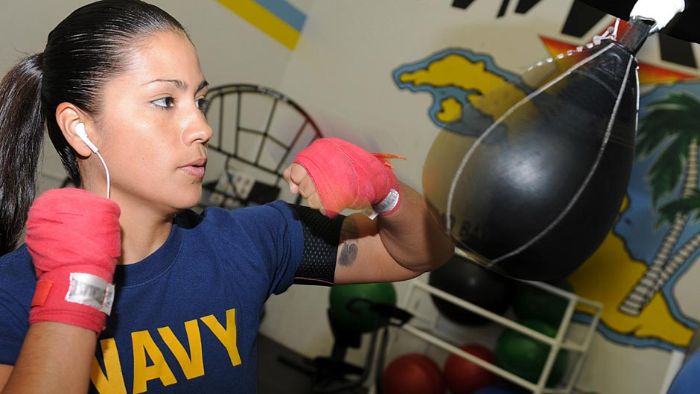 Master-at-Arms 2nd Class Nancy Mora works out on a speed bag.