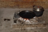 A pan on an open fire