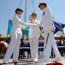 Coast Guard members shake hands. 