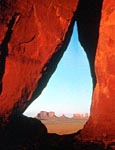 a view through a hole in a rock