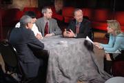 John Podesta, Edie Weiner, Eric Green, Robert Engelman talking with Producer at table in studio 