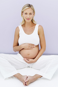 pregnanct woman sitting on the floor