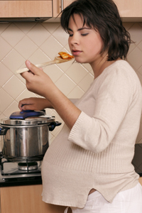 pregnant woman cooking