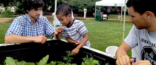 Bronson Brown and staff from D.C. Central Kitchen explores USDA's People's Garden on the opening day of the USDA Farmers Market.