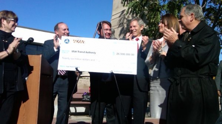 Utah Transit Authority accepting an oversized cheque.