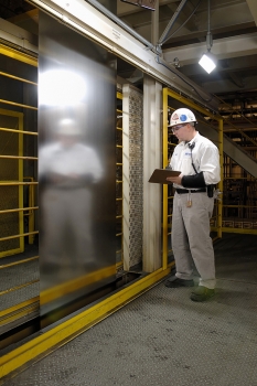 Worker from PRO-TEC inspecting coated steel (Photo: PRO-TEC)