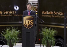 Secretary Locke with UPS vehicles. Click for larger image.