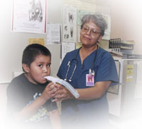 Nurse and boy patient. Photo Courtesy of the Indian Health Service/U.S. Department of Health and Human Services.