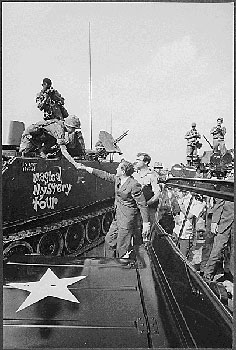 Richard M. Nixon shaking hands with armed forces in Vietnam