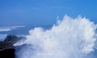 Ocean waves breaking over rocks