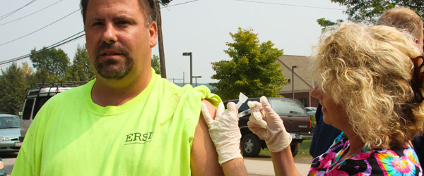 A man receives medical attention after a disaster