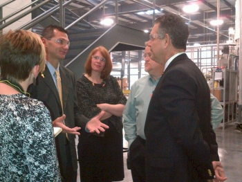 Deputy Assistant Secretary Kim Glas and Under Secretary Francisco Sanchez tour Unifi’s sewing thread manufacturing facility in Yadkinville, North Carolina on October 9, 2012.