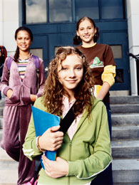 students standing in front of school