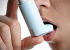A person uses an inhaler