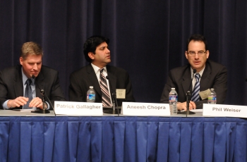 The three principal speakers at forum table