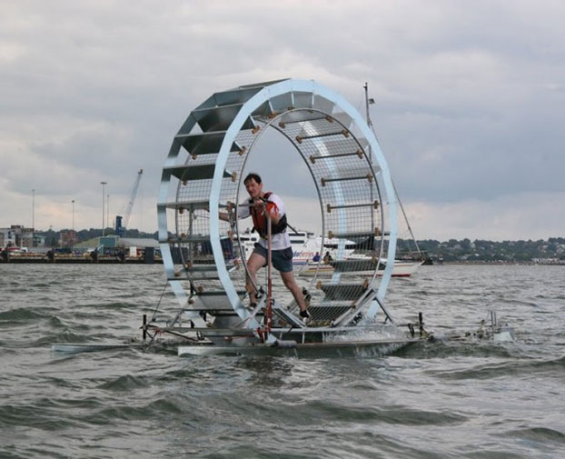 Man Attempts ‘Walking’ Across Sea in a Human-Sized Hamster Wheel (Photos)