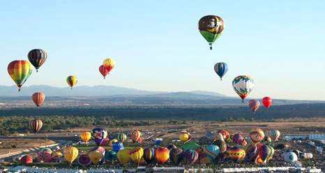 Hot-air balloons of every design and color head skyward during a mass ascension at the 2008 Albuquerque Balloon Fiesta.