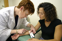 Doctor administering a skin test