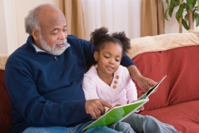 Grandfather read daughter a book