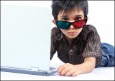 Boy with 3d glasses and a laptop