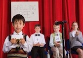 Child with award at spelling bee