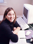 girl smiling at computer