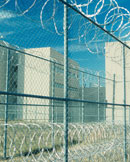 prison with barbed wire fence