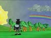A cartoon character stands in a field looking at a rainbow