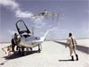 A man standing near a plane in the salt flats looking at a plane flying in the sky