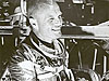 Glenn wears his silver Mercury spacesuit