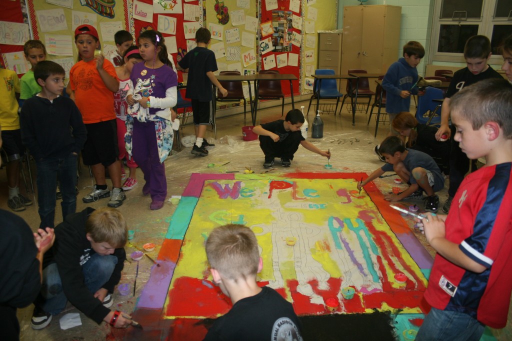 Students paint during East Hanover's Community Night of Respect