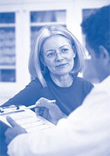 Image of an old woman talking with her docter