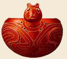 (photo) Red ceramic bowl in the shape of an animal made by ancient Americans. (NPS)