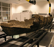 (photo) A wooden canoe in a conservation lab. (NPS)
