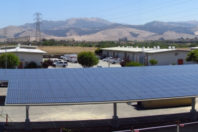 A portion of the new 141 kilowatt solar photovoltaic energy system at Monterey County’s Laurel Yard Complex in Salinas, California. The system is expected to save the county thousands of dollars a year in energy costs. <a href="http://energy.gov/sites/prod/files/monterey-california-solar-array-panorama.jpg">Click here</a> to see a panoramic view of the entire solar array. | Photo courtesy of Santa Cruz Westside Electric, DBA Sandbar.