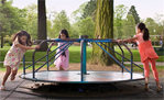 Children playing on a merry-go-round