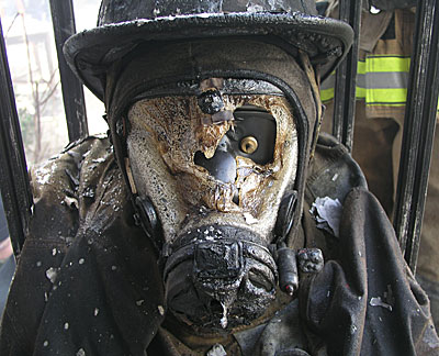 firefighter's mask with hol melted in it