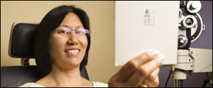 A woman taking an eye exam